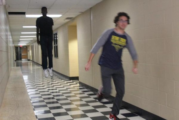 The Not-So-Real Truth Behind the Floating Man in the Checkered Hallway